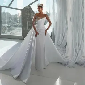 Elegant Mermaid Wedding Dress with Illusion Neckline, Beaded Long Sleeves, and a Detachable Overskirt